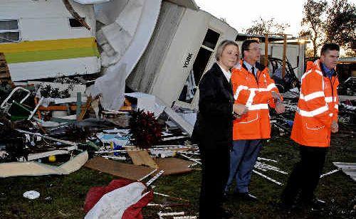 NSW Premier Kristina Keneally inspects tornado damage yesterday morning at the Lake Ainsworth Caravan Park with NSW SES Commissioner Murray Kear (centre) and NSW Emergency Services Minister Steve Whan. . Picture: Jay Cronan