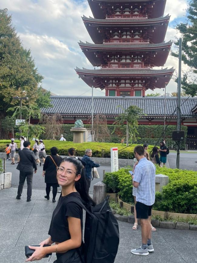 Melbourne defender Steven May has headed to Japan, his girlfriend Sachi pictured outside the Senso-Ji Temple.