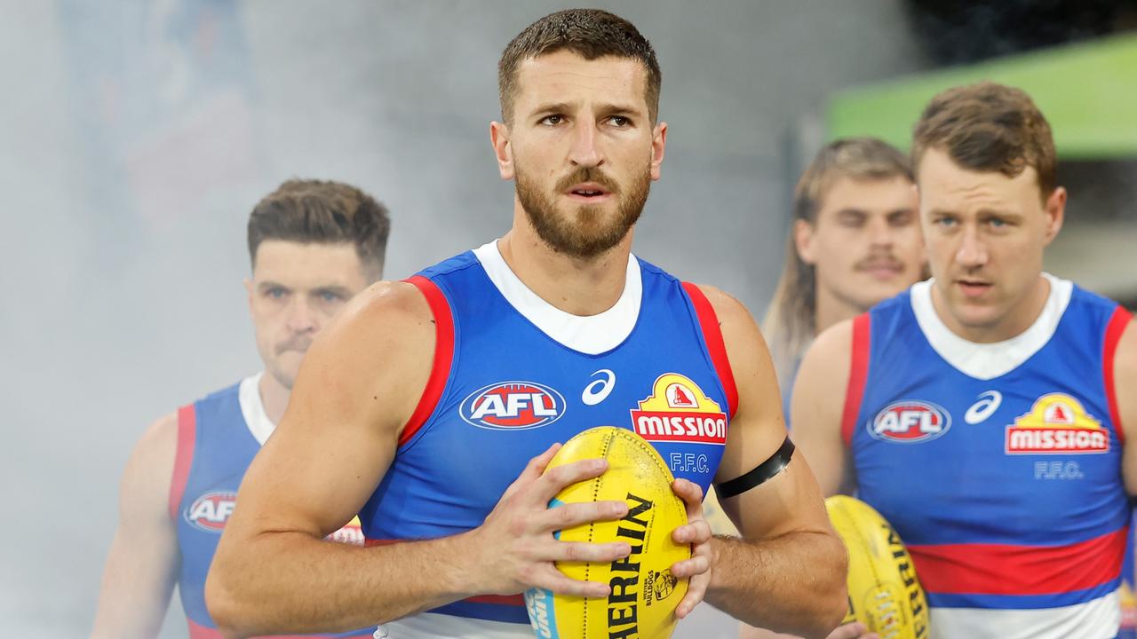 MELBOURNE, AUSTRALIA - MARCH 18: Marcus Bontempelli of the Bulldogs leads his team out from the rooms during the 2023 AFL Round 01 match between the Melbourne Demons and the Western Bulldogs at the Melbourne Cricket Ground on March 18, 2023 In Melbourne, Australia. (Photo by Dylan Burns/AFL Photos via Getty Images)