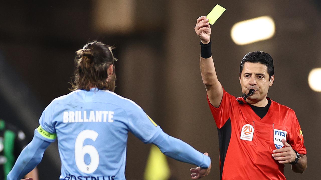 Melbourne City captain Josh Brillante of Melbourne City is shown the yellow card by referee Alireza Faghani in City’s 2-0 semi-final win over Western United. Picture: Cameron Spencer/Getty Images