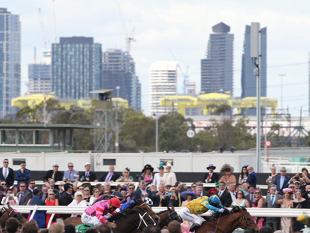 Race 2 and the horses thunder for the finish line, the #World’sMostLiveableCity as the backdrop. Picture: Wayne Ludbey