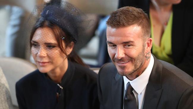 David and Victoria Beckham take their seats in St George's Chapel before the wedding ceremony of Britain's Prince Harry, Duke of Sussex and US actress Meghan Markle. Picture: AFP Photo