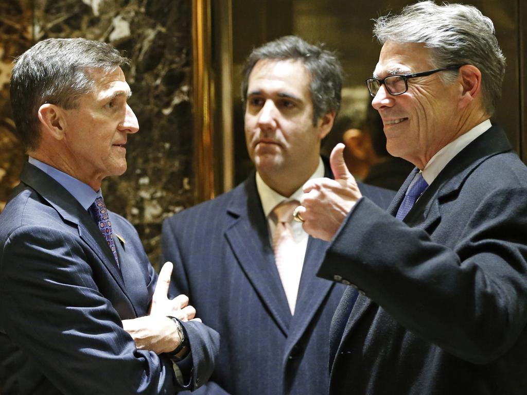 Mochael Cohen (centre) pictured at Trump Tower in 2016 with General Michael T. Flynn (left), who is also under investigation, and Texas Governor Rick Perry. Picture: AP 