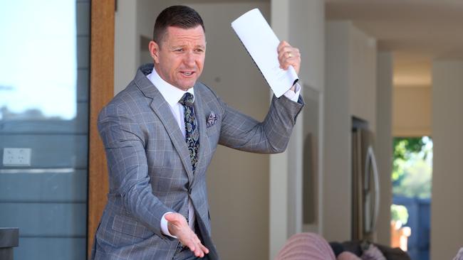 Auctioneer David Cortous at work in Newtown, inner-western Sydney, in March before the property industry was hit with coronavirus restrictions. Picture: Glenn Ferguson