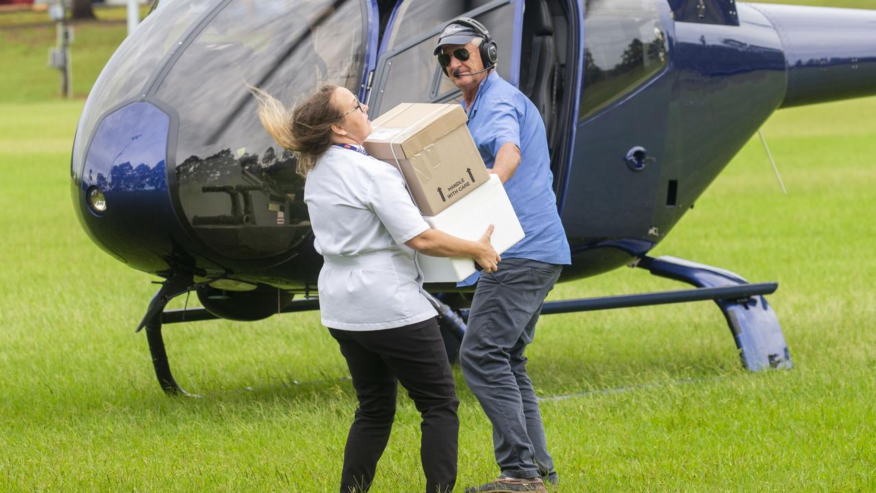 Chemist Warehouse owner Kate Daniel receives a delivery of lifesaving drugs that was flown in on Thursday morning. Picture: Media-Mode