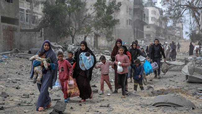 Palestinians flee the area after Israeli bombardment in central Gaza City. Picture: AFP