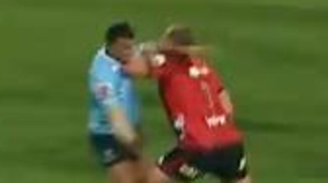 Crusaders prop Joe Moody elbows Kurtley Beale.