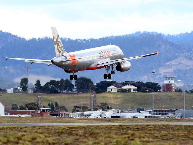 SUNTAS: Generic shots of planes taking off or coming into land, at Hobart Airport. a Jetstar plane landing