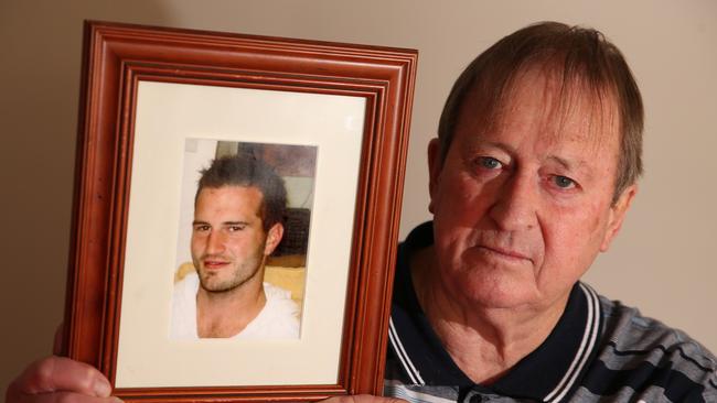 Gary Kingsbury with a photo of his son, who was last seen on July 6, 2014. Picture: Alison Wynd