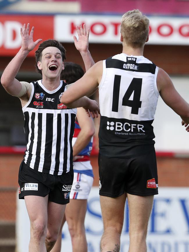 Port’s Zak Butters is all smiles after Billy Frampton kicks another goal. Picture: Sarah Reed