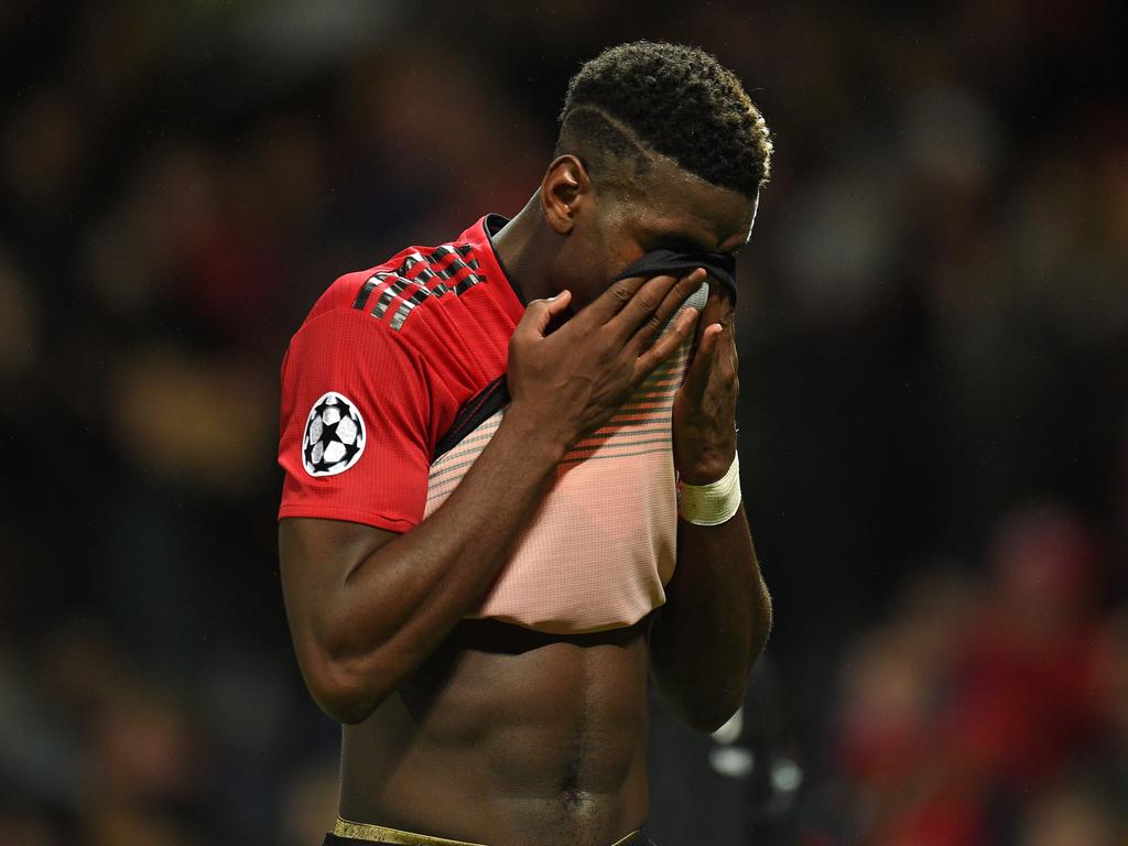 Manchester United's French midfielder Paul Pogba reacts on the pitch after the Champions League group H football match between Manchester United and Juventus at Old Trafford in Manchester, north west England, on October 23, 2018. - Juventus won the game 1-0. (Photo by Oli SCARFF / AFP)