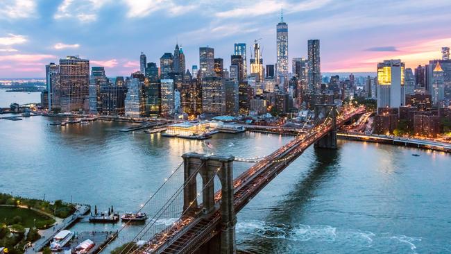 Economists expect the Omicron variant to cause a short-term soft patch for US spending and broader economic growth. Above, Lower Manhattan. Picture: Matteo Colombo