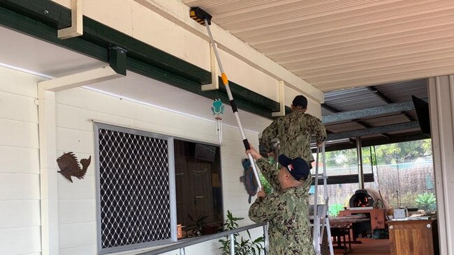 Ship shape … sailors from the USS Ronald Reagan went to Woodridge Centre Burringilly to help clean up for NAIDOC Week.