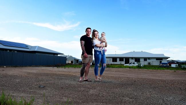 Jarrett Sherman, Shay Robinson and their daughter Kyla Sherman, pictured in 2019 on a plot of land in Zuccoli where they planned to build their first home. Picture: Justin Kennedy