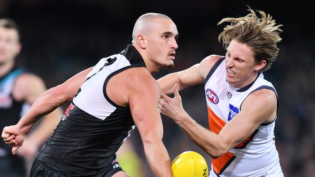 Sam Powell-Pepper of the Power (left) and Lachie Whitfield of the Giants contest the ball in Round 18, 2018. Picture: AAP Image/David Mariuz