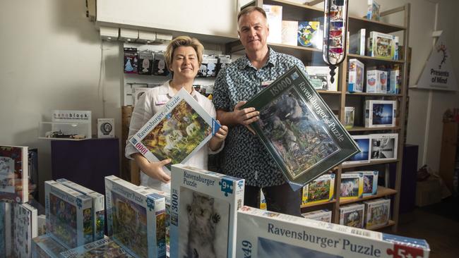 Kellie and Glenn Lindstrom have seen jigsaw puzzles fly off the shelves in their Presents of Mind stores in Paddington, Toowong and Fairfield. Picture: Mark Cranitch.