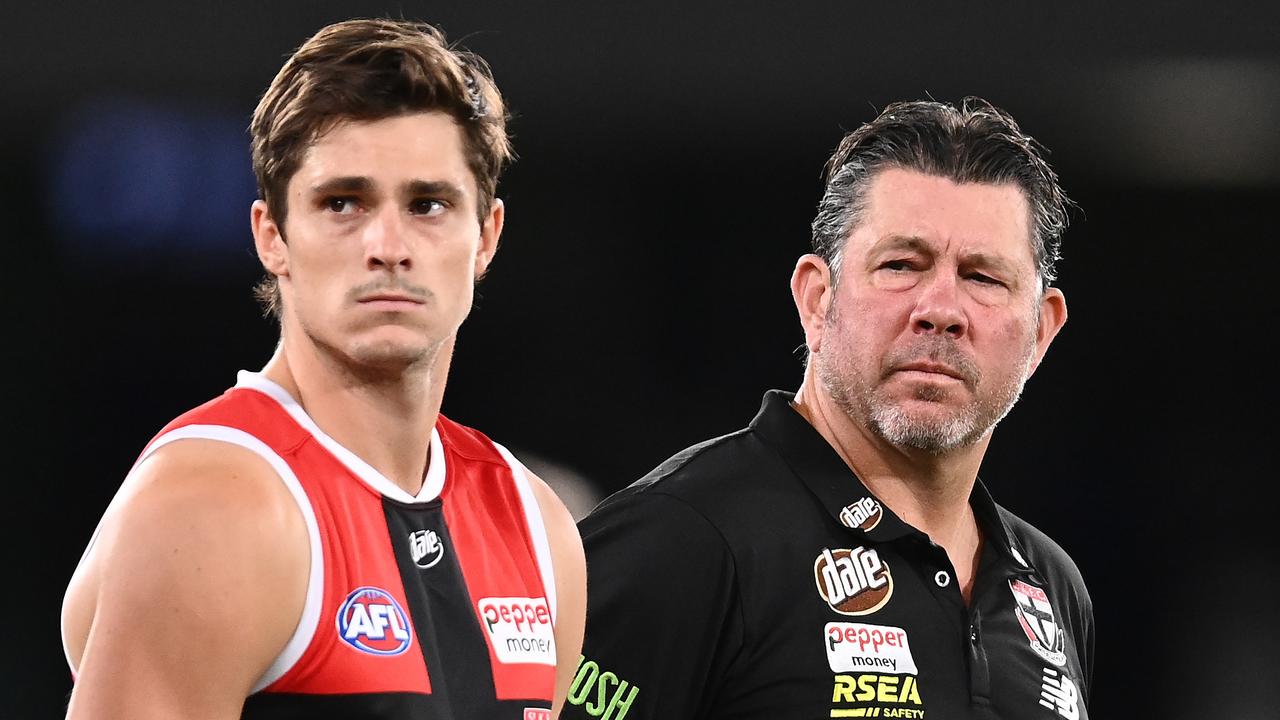 MELBOURNE, AUSTRALIA - MARCH 05: Jack Steele of the Saints and Saints head coach Brett Ratten stand for a minute silence for Shane Warne during the AFL AAMI Community Series match between the Essendon Bombers and the St Kilda Saints at Marvel Stadium on March 05, 2022 in Melbourne, Australia. (Photo by Quinn Rooney/Getty Images)