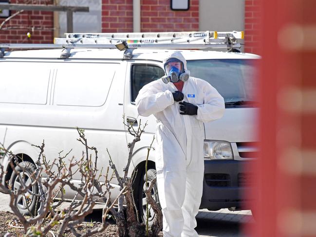 Cleaners at Thebarton Senior College after a potentially infectious person attended the school. Picture: Tom Huntley