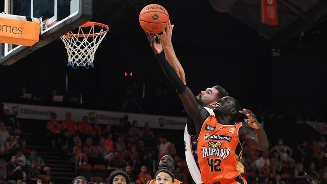 Isaac Humphries of the 36ers and Bul Kuol of the Taipans compete for the ball. (Photo by Albert Perez/Getty Images)