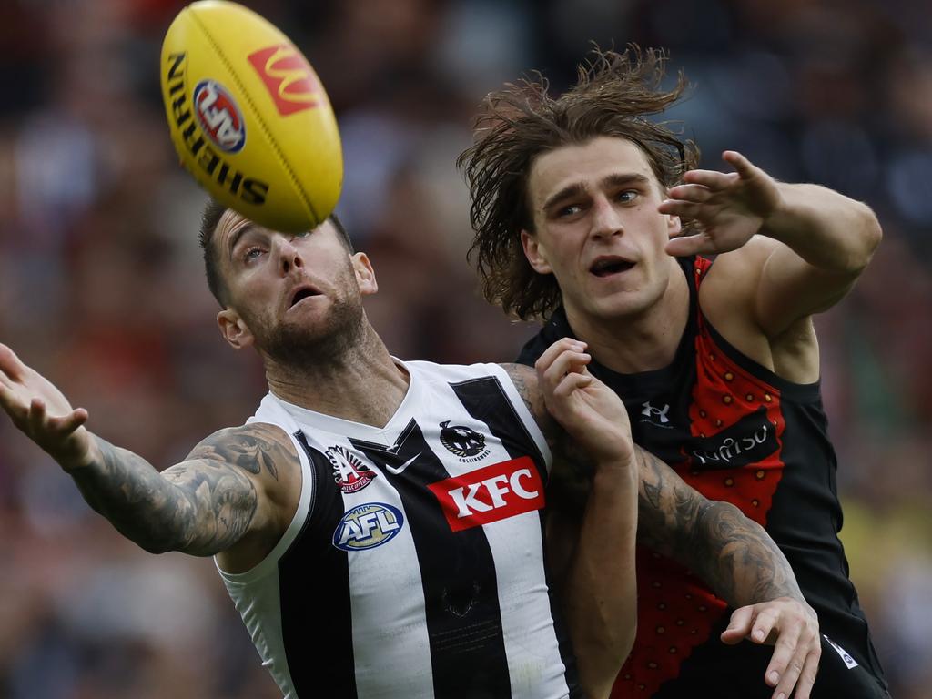 Jeremy Howe of the Magpies and Harrison Jones of the Bombers battle . Pic: Michael Klein