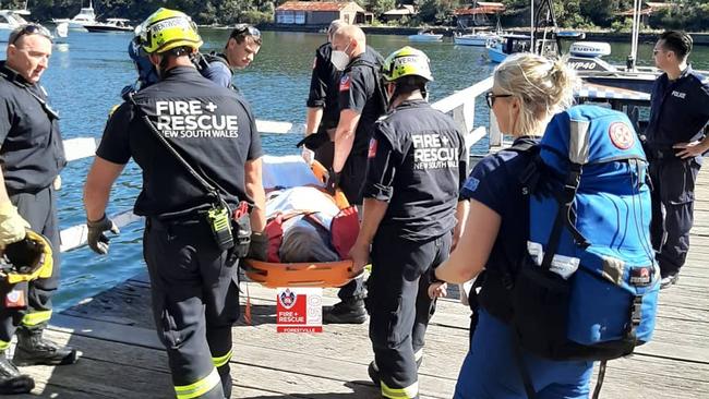 The woman was taken by a Water Police paunch from Bantry Bay to The Spit to transfer to an ambulance which took her to Northern Beaches Hospital. Picture: NSW Fire and Rescue (Forestville)