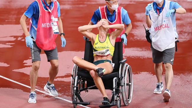 Genevieve Gregson reacts as she is wheeled off in Tokyo. Picture: Matthias Hangst/Getty mages