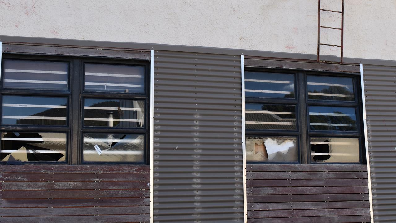 Smashed windows on the outside of the Central Hotel.