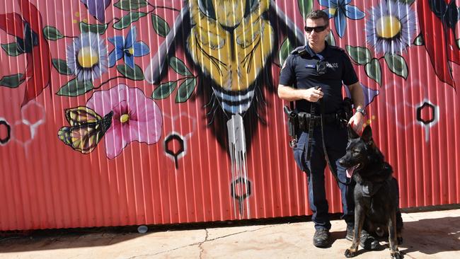 Police Dog Wedge and handler Senior Constable First Class Matthew Unwin helped to find a woman who had gone missing in bushland near the CBD. Picture: NT Police