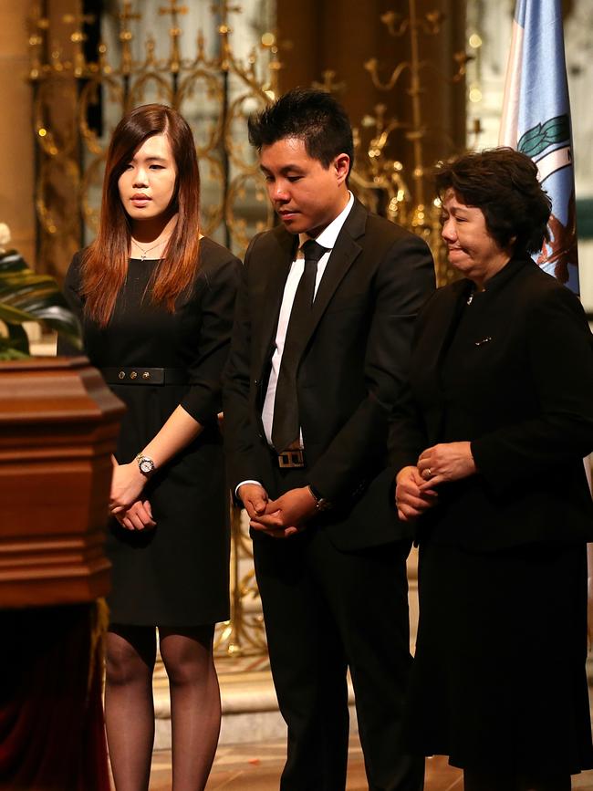 Family grieving at Mr Cheng’s funeral  at St Mary's Cathedral.