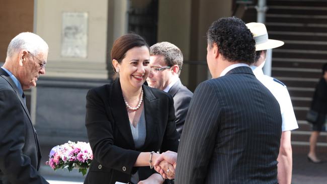 Flashback — then Opposition leader Annastacia Palaszczuk greets Health Minister John-Paul Langbroek at an Anzac Day service. Picture: Tim Marsden.