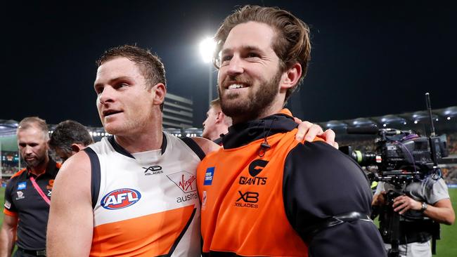 An injured Callan Ward with Heath Shaw after the Giants’ semi-final win last season. Picture: Getty Images