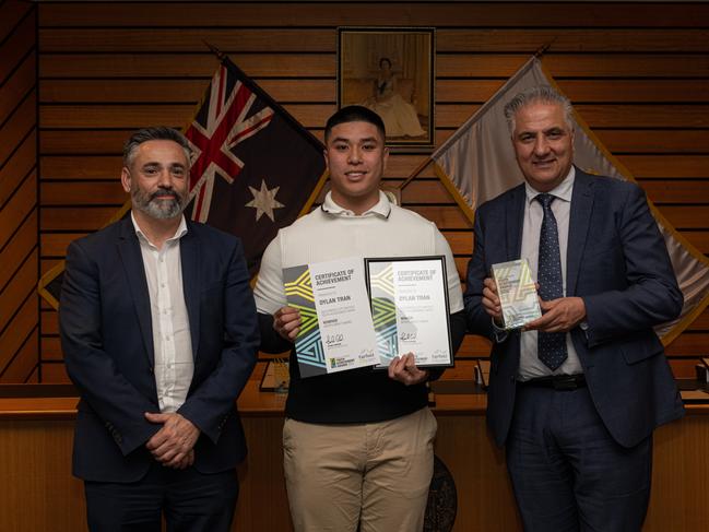 Sports Impact Award recipient Dylan Tran (centre).