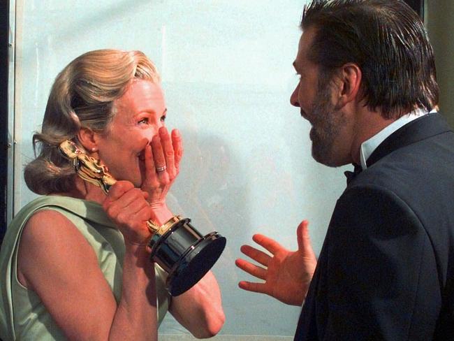 Kim Basinger and her then husband, Alec Baldwin, react backstage after she won the Oscar for Best Supporting Actress.