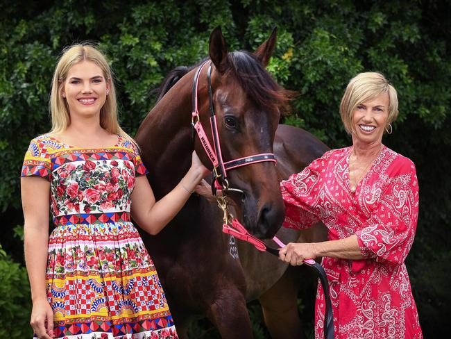 Gold Coast horse trainer Gillian (right) and daughter Tayla Heinrich at their stables with horse Invinsible Tears, which will feature in the Summer Racing Carnival. Picture: Adam Head