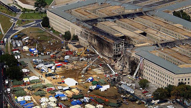 Firefighters, rescue workers and engineers at work at the site. Picture: AFP