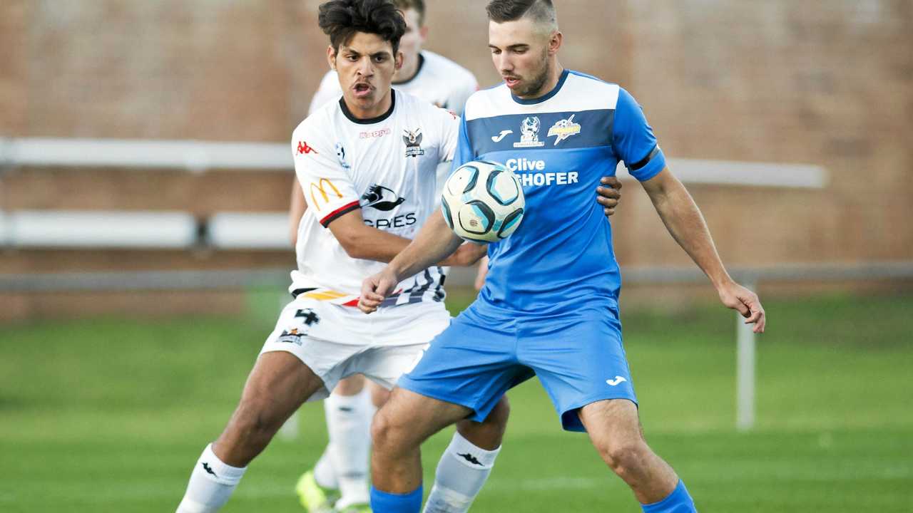 DOUBLE DELIGHT: South West Queensland Thunder striker Anthony Grant (right) scored a double in his side's 2-1 win over Moreton Bay United last weekend. Picture: Nev Madsen