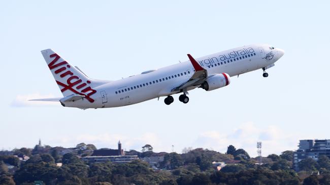 Virgin Australia cancelled 14.7 per cent of flights and had an on-time performance of 43 per cent last week. Picture: NCA NewsWire / Damian Shaw