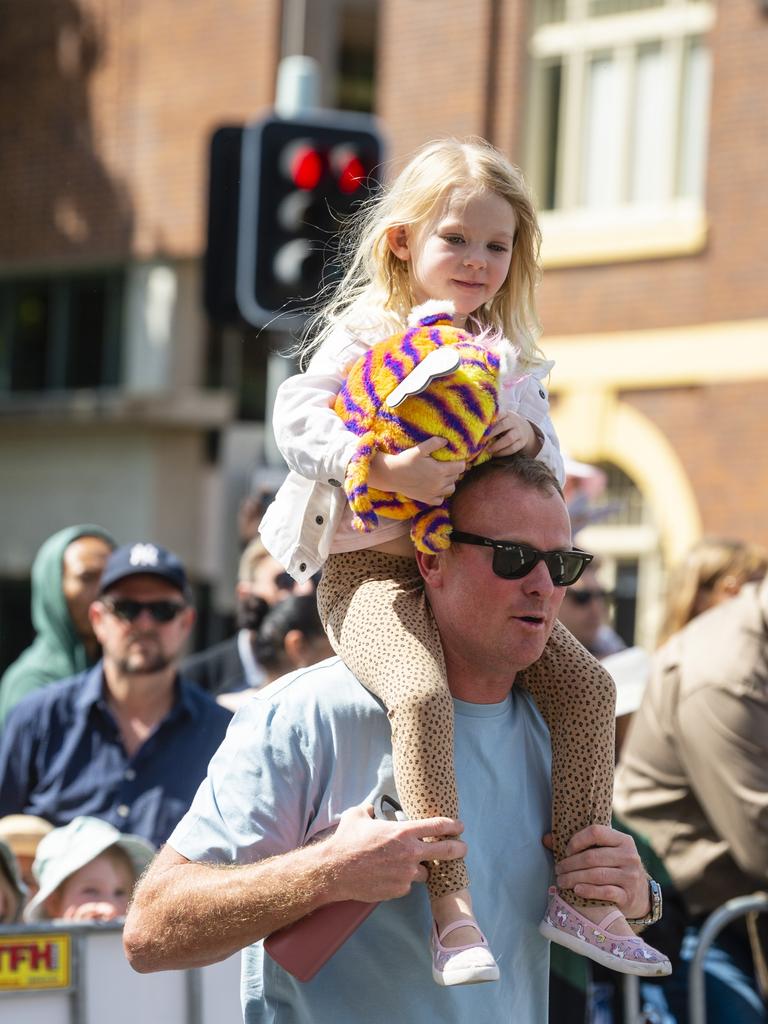 Mahlia Lavender gets a ride from dad Ryan Lavender before the Grand Central Floral Parade of Carnival of Flowers 2022, Saturday, September 17, 2022. Picture: Kevin Farmer