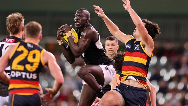 Gamebreaker Aliir Aliir takes a telling mark against the Adelaide Crows. Picture: Getty Images