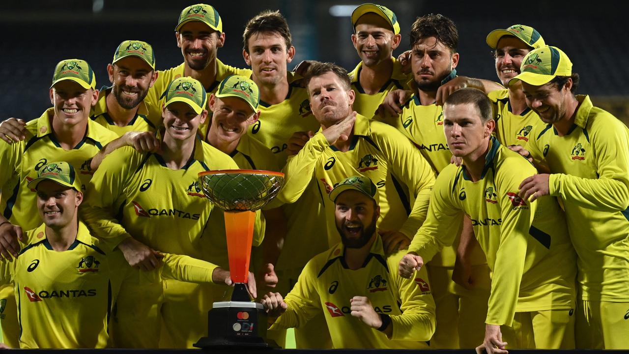 Australia's players celebrate after winning the third one-day international and the series. Picture: Arun Sankar / AFP