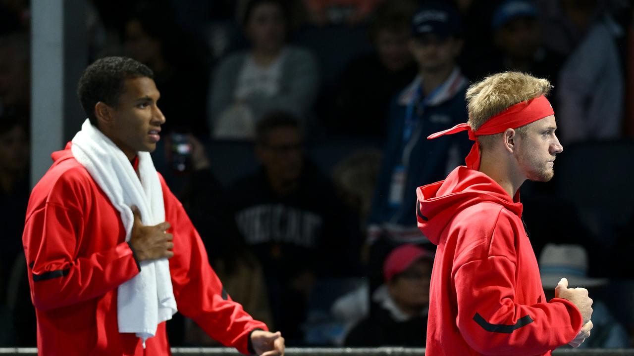 Felix Auger-Aliassime (L) of Canada and Alejandro Davidovich Fokina (R) of Spain move courts as a result of rowdy fan behaviour on Wednesday night. (Photo by Hannah Peters/Getty Images)