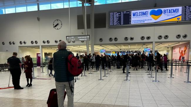 Back to normal – morning travellers seen at Adelaide Airport about 7.30am on Tuesday. Picture: Emma Brasier