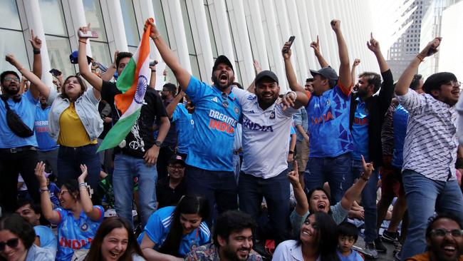 Fans gather at the Oculus in Lower Manhattan to watch the group A cricket match between India and Pakistan. Picture: Leonardo Munoz/AFP