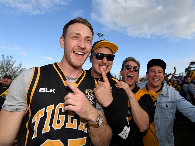 Tigers fans celebrate the team's win. Picture: AAP Image/Joe Castro