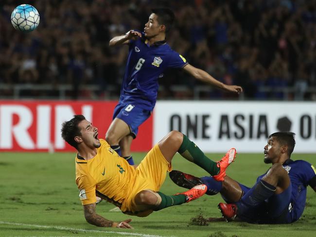 Jamie Maclaren of the Socceroos lands awkwardly.