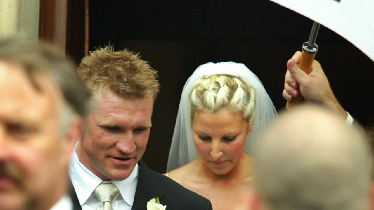 Nathan Buckley and Tania Minnici on their wedding day at St Ignatius Church in Richmond.