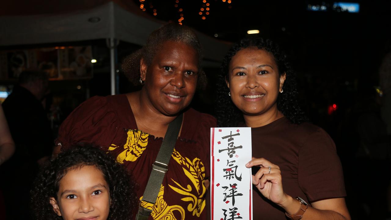 Mikasa Mossman, Grethel Guligo and Salathy Chan celebrate the last night of Chinese New Year festivities in Cairns. Picture: Kate Stephenson