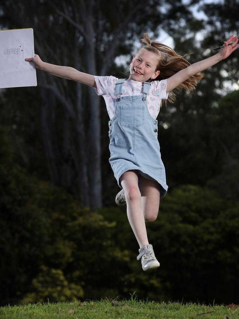 Georgie Bozhoff, 7, a Year 2 student at Augusta State School near Ipswich in Queensland, was “just so excited” about winning the K-2 category of the competition with her story The Cheese Moon. Picture: Liam Kidston