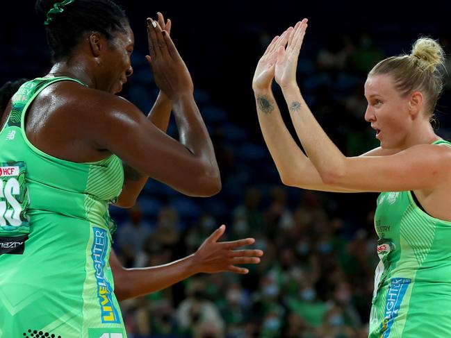 PERTH, AUSTRALIA - MARCH 27: Sasha Glasgow of the fever and Jhaniele Fowler of the fever high five after the 1st quarter  during the round one Super Netball match between West Coast Fever and Sunshine Coast Lightning at RAC Arena, on March 27, 2022, in Perth, Australia. (Photo by James Worsfold/Getty Images)