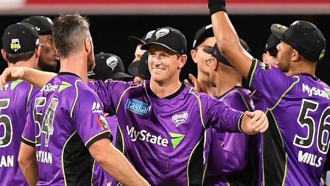 Hobart Hurricanes captain George Bailey celebrates with his teammates after they beat the Brisbane Heat on Wednesday night.